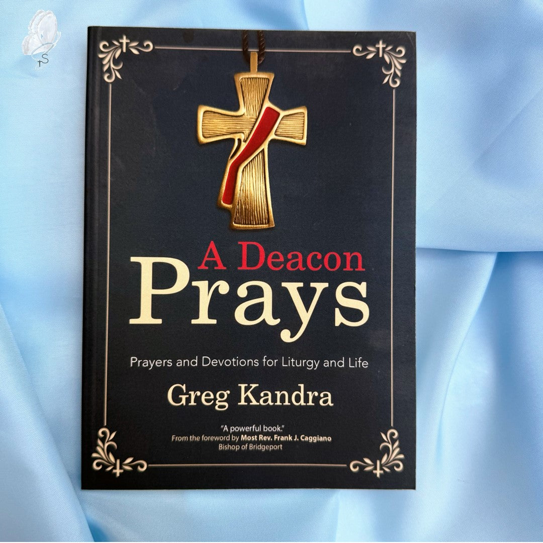 Book titled 'A Deacon Prays' by Greg Kandra with a cross on the cover against a light blue background.