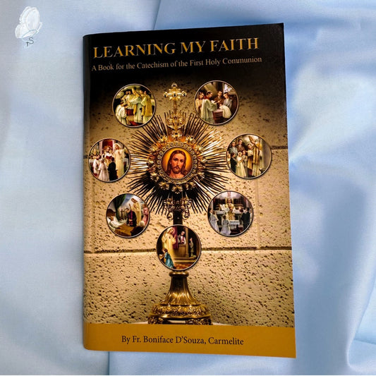 Book titled 'Learning My Faith' with a religious design on the cover against a light blue background.